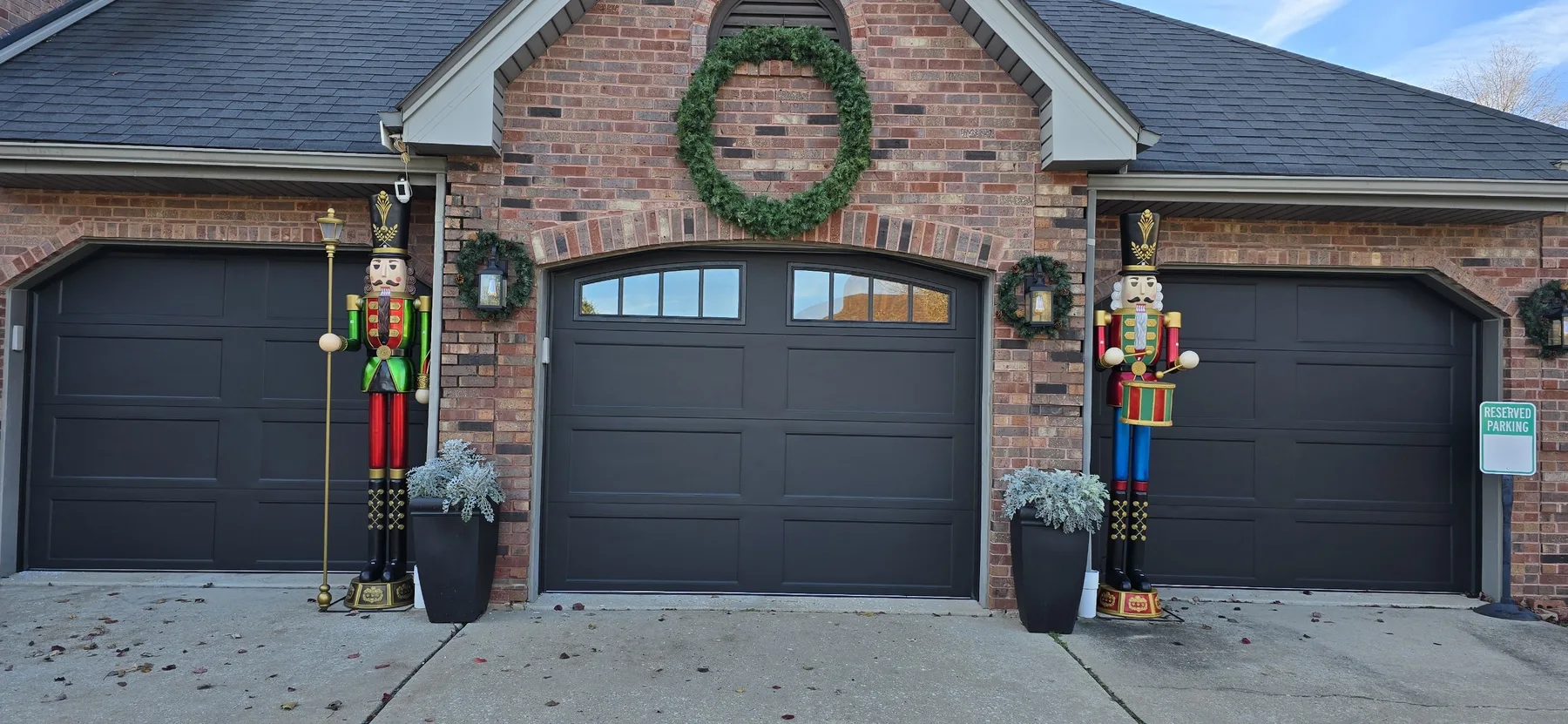 Three Clopay Bridgeport Steel garage doors in Lustra Black