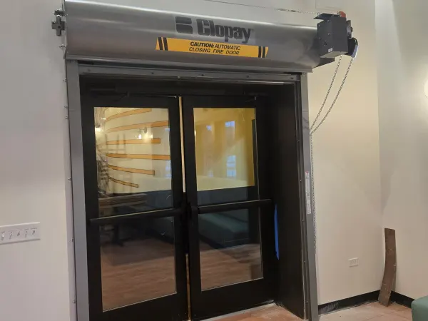 Black modern entry door with vertical glass panels