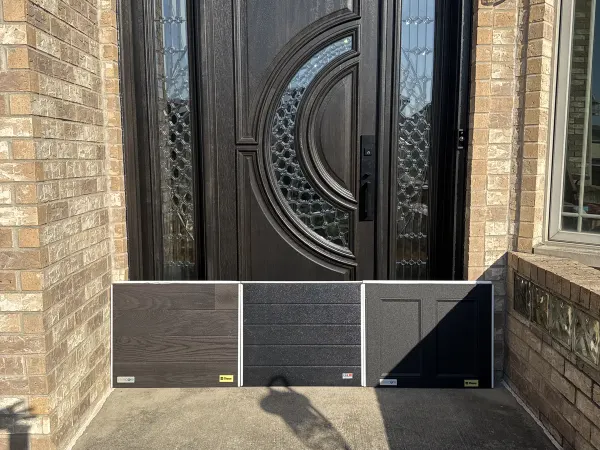 Dark double entry doors on a brick home