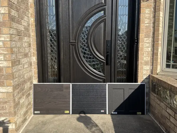 Dark double entry doors on a brick home