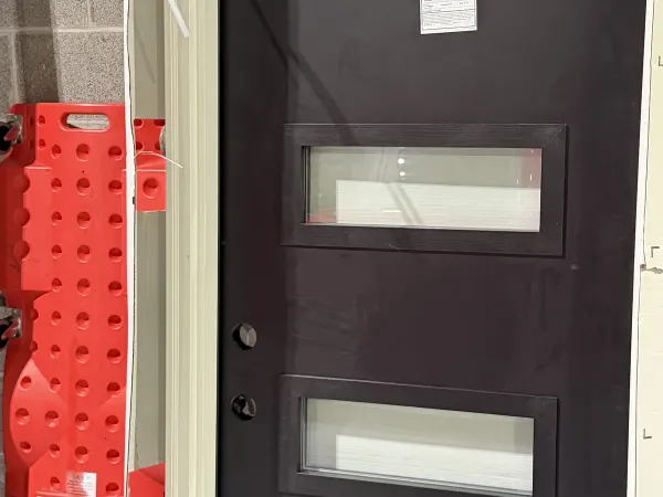 Modern entry door with vertical glass slits
