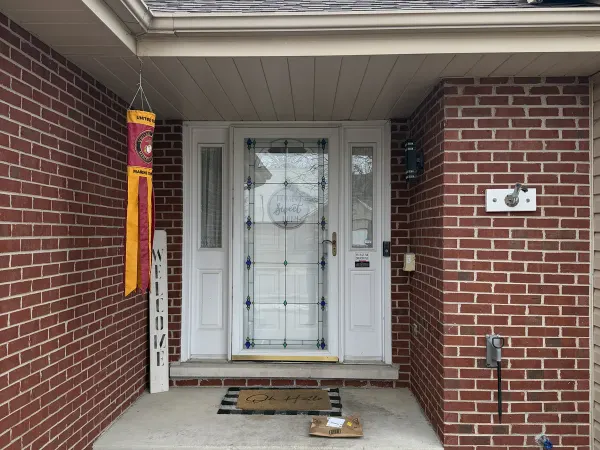 White classic entry door with sidelights