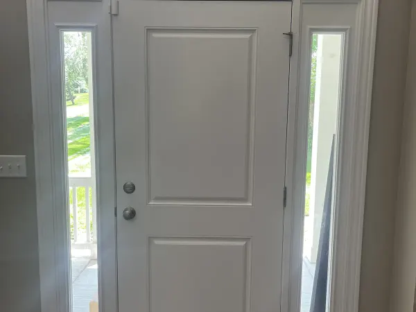White grand entry door with full sidelights and transom