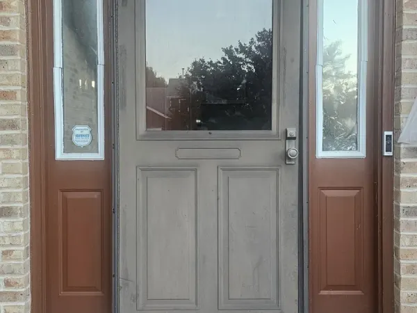 White entry door with full sidelights and arched transom
