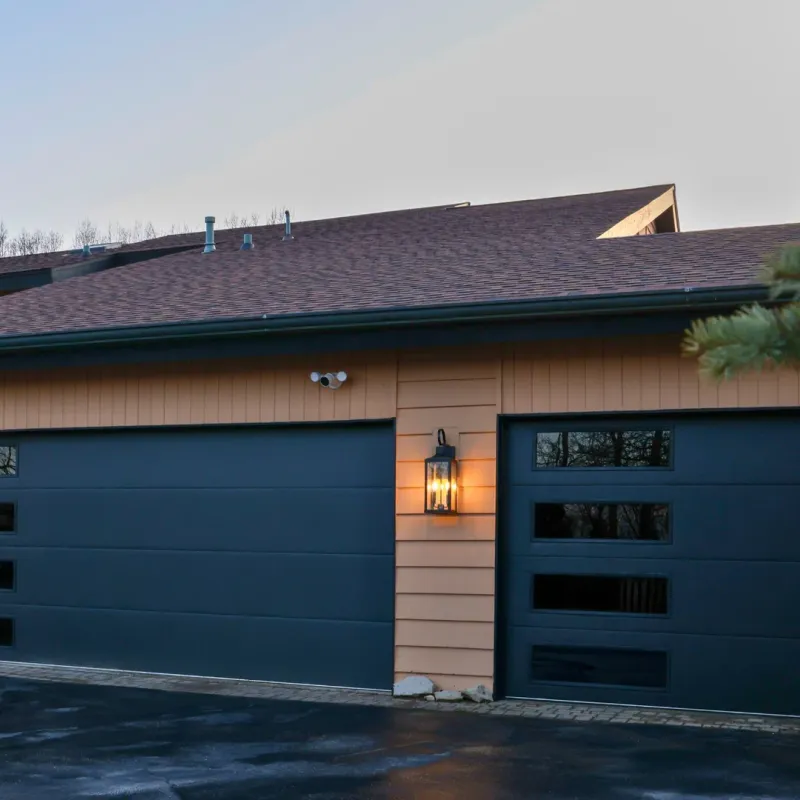 Modern black garage doors with horizontal glass panels