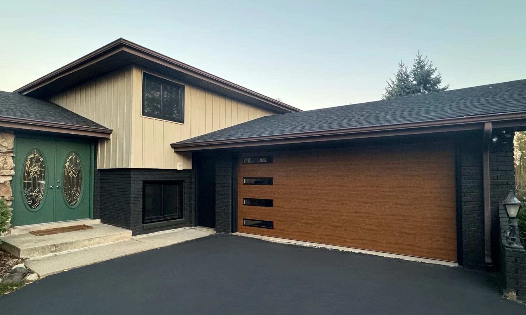 Contemporary wood-tone garage door with horizontal windows