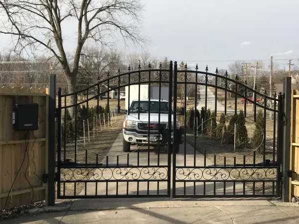 Black ornamental residential swing gate