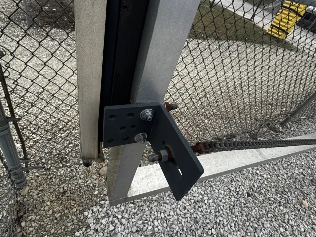 Cantilever slide gate operator install with v-track — eliminates the ground track that traditional slide gates jam against in snow and debris.
