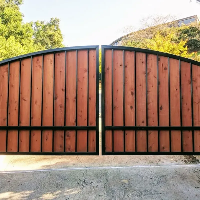 Custom wood-and-iron arched driveway gate install