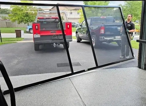 Lifestyle Screen in a 2-car garage opening with brick exterior