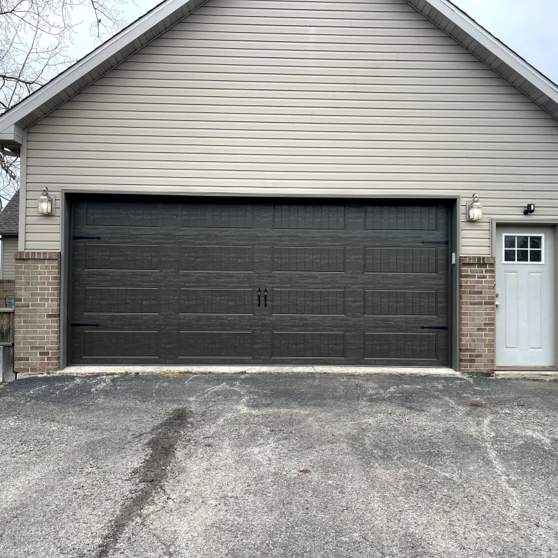 Gray raised-panel garage door installation, the Chicago Suburbs