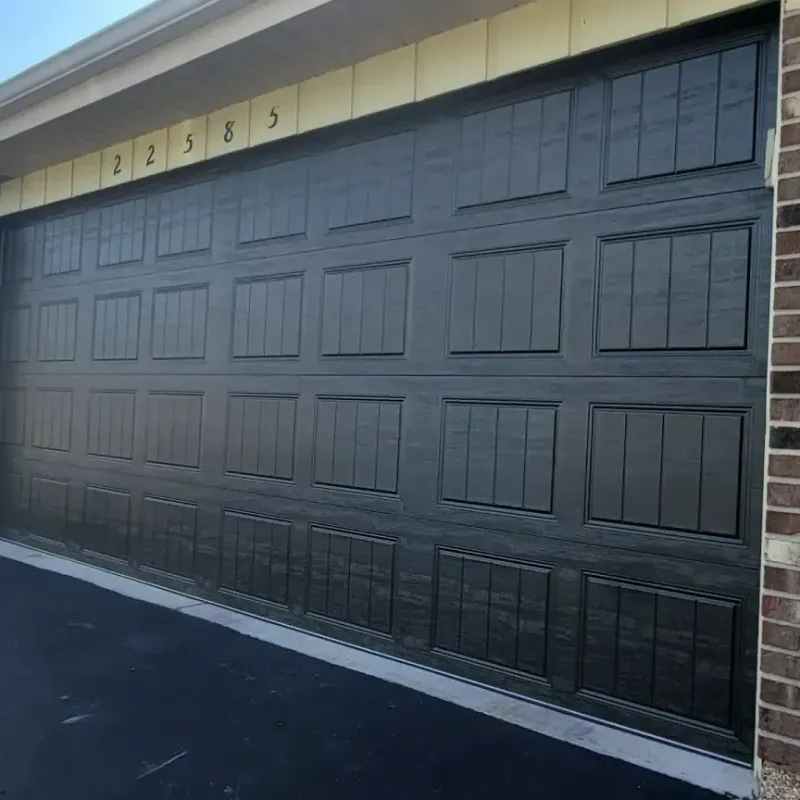 Black sectional garage door — flat-panel install