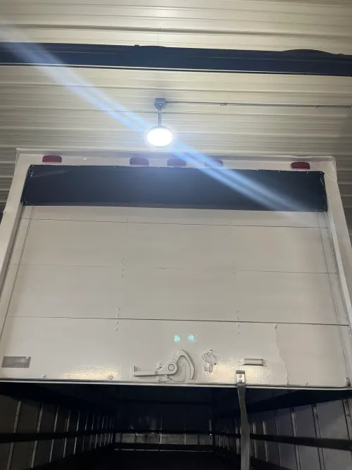 Top of a roll-up cargo door from inside showing tracks and hardware