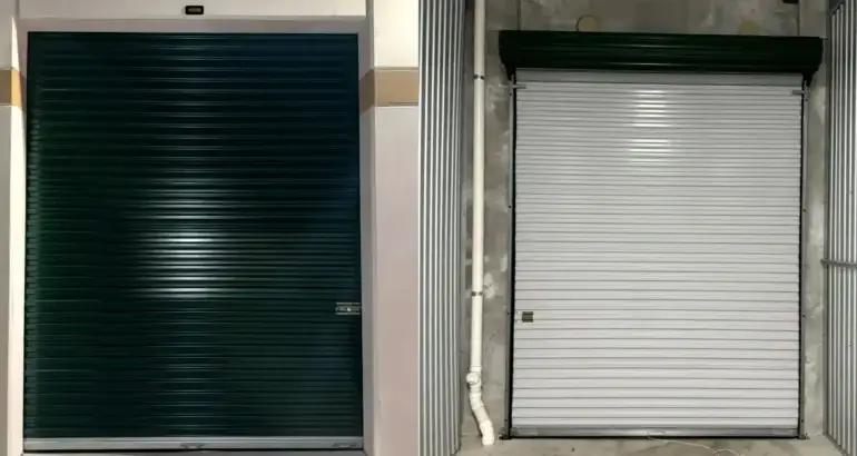 Two commercial overhead doors side by side; the left door is dark green and fully closed, the right door is white and fully closed, showcasing options for commercial overhead door repair.