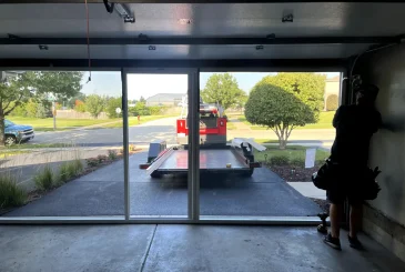 A technician installed a garage door. A guide picture for a blog about Garage Door Installation.