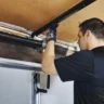 man-repairing-and-fixing-a-garage-door