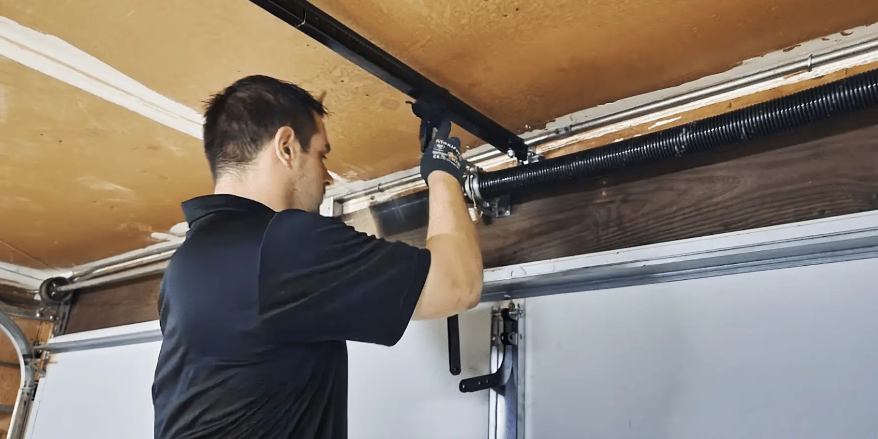 man-repairing-and-fixing-a-garage-door