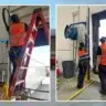 Technicians performing commercial overhead door installation and repair services in New Lenox